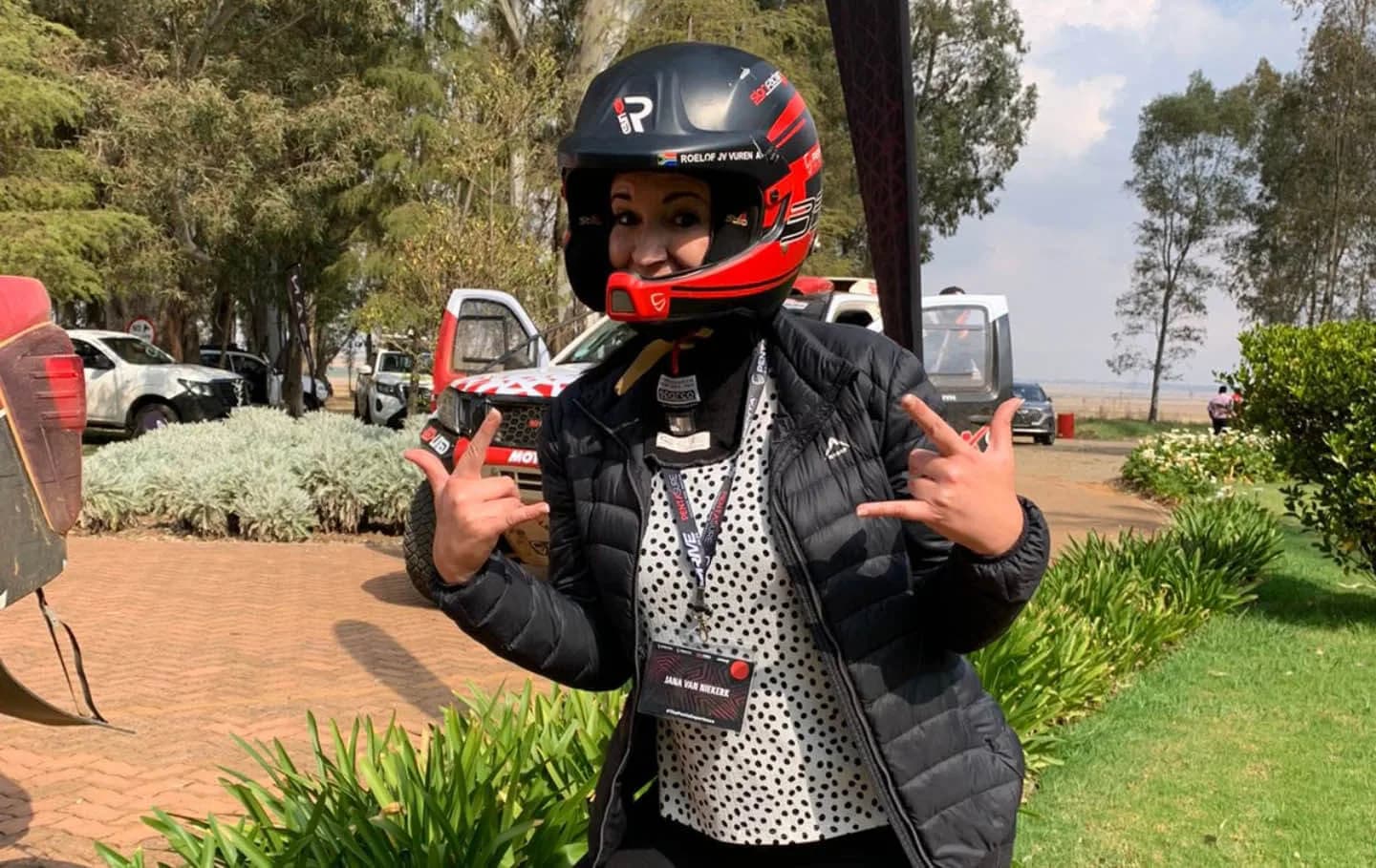 A guest wearing a Red-Lined driver's helmet at a corporate day